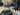 Close-up of a mechanical component with a brush on a workshop background